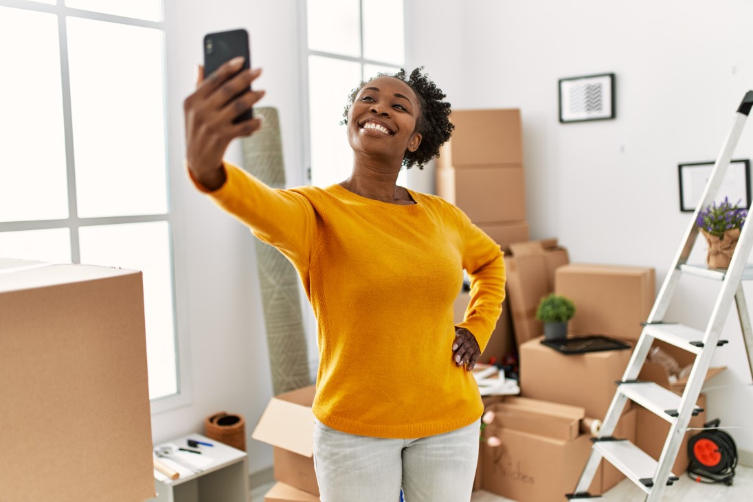african-american-woman-make-selfie-by-smartphone-standing